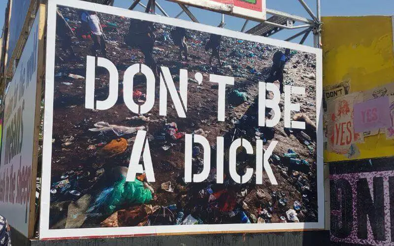 Bill board at Glastonbury festival letting you know to not be a dick