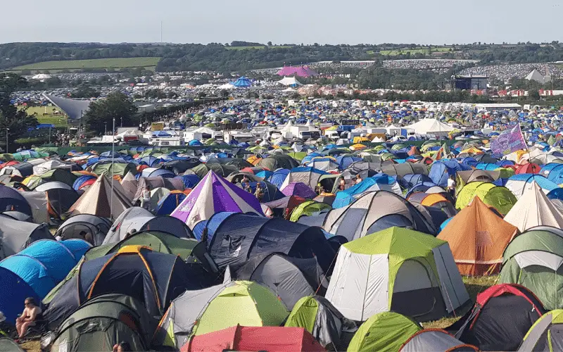 A sea of tents at a festival - best self-inflating sleeping mats
