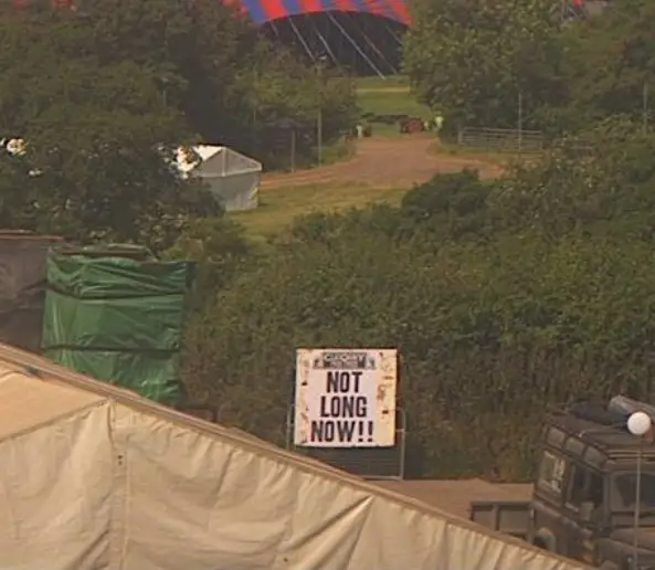 Glastonbury Festival Webcam image of a Glastonbury Free Press poster saying "Not Long Now!!"