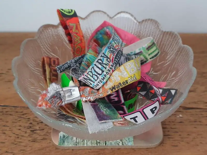 festival wristbands in a glass bowl
